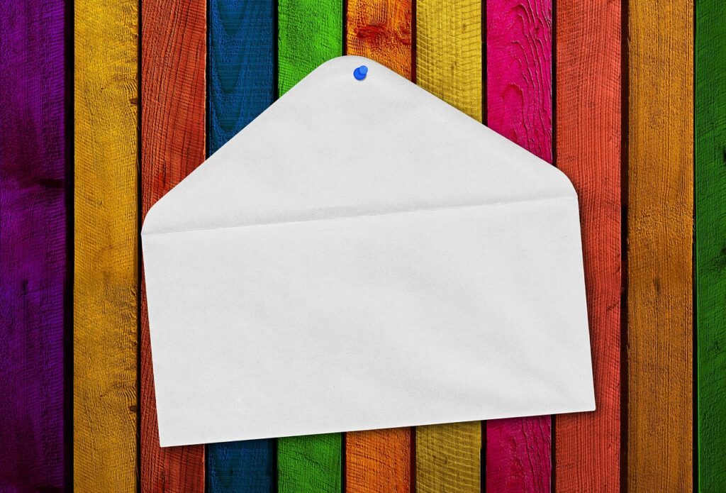 query letter envelope tacked to colorful wall