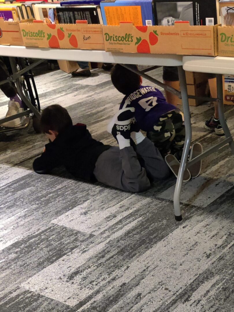 books in reading nook under the table