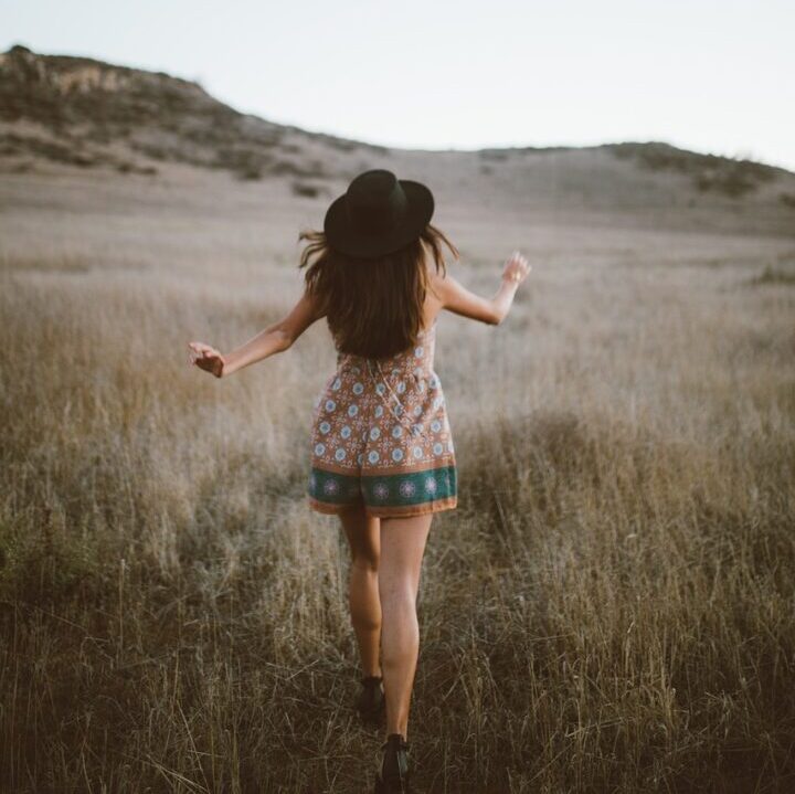 woman running through a field