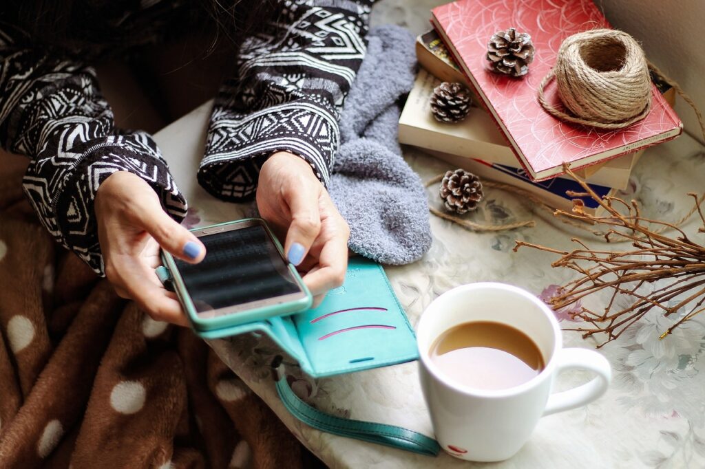 woman checking her social media followers on her phone