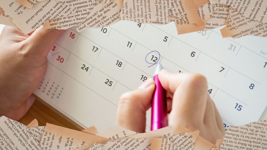 book blurb; book pages with calendar pages behind them